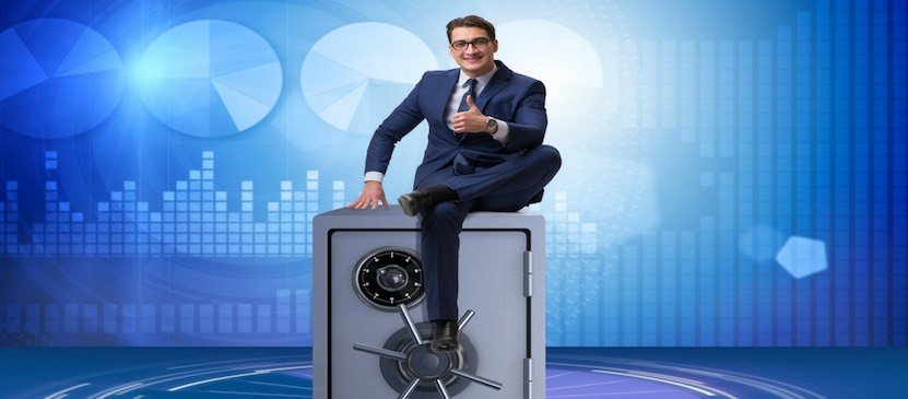 businessman sitting on a secure safe