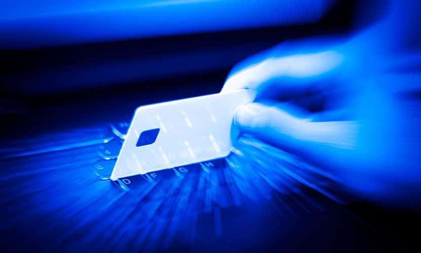 hand over a laptop to use a credit card online