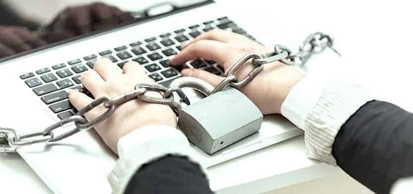 a woman locked to a computer representing neutral colocation providers